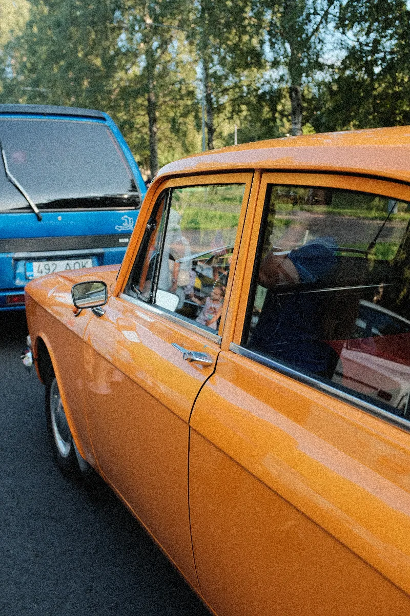 A photo of a retro yellow car.